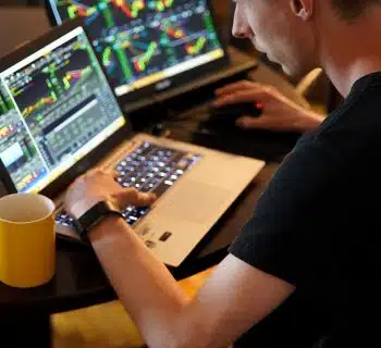 man sitting in front of the laptop